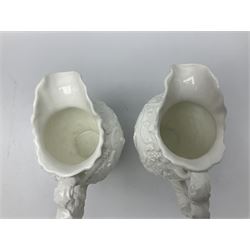 Pair of early/mid 19th century Copeland and Garrett white glazed pitchers, modelled in the Georgian style and moulded with the figures of Venus the Roman Goddess of Love, and Aurora the Roman Goddess of Dawn, within C scroll borders and foliate surround, the naturalistically modelled handle leading to a fruiting vine beneath the rim, upon a spreading base moulded with seashells, with printed green crowned wreath mark beneath, H20cm