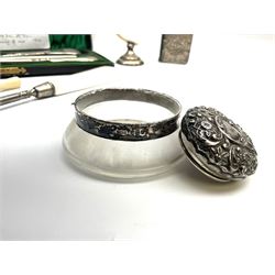Cased silver handled glove stretcher, button hook, shoe horn, etc., hallmarked Adie & Lovekin Ltd, Chester 1911, and Adie & Lovekin Ltd, Birmingham 1911, miniature silver mounted hymn book, the cover embossed with cherubs, silver handled button hook, ivory handled button hook with silver ferrule, two silver dressing table pot lids, etc. 