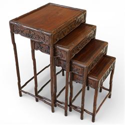 Chinese hardwood nest of four tables, each rectangular top within a moulded border above c...