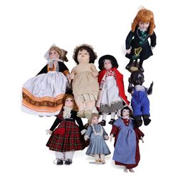 Two Pedigree baby dolls and a collection of regional porcelain costume dolls