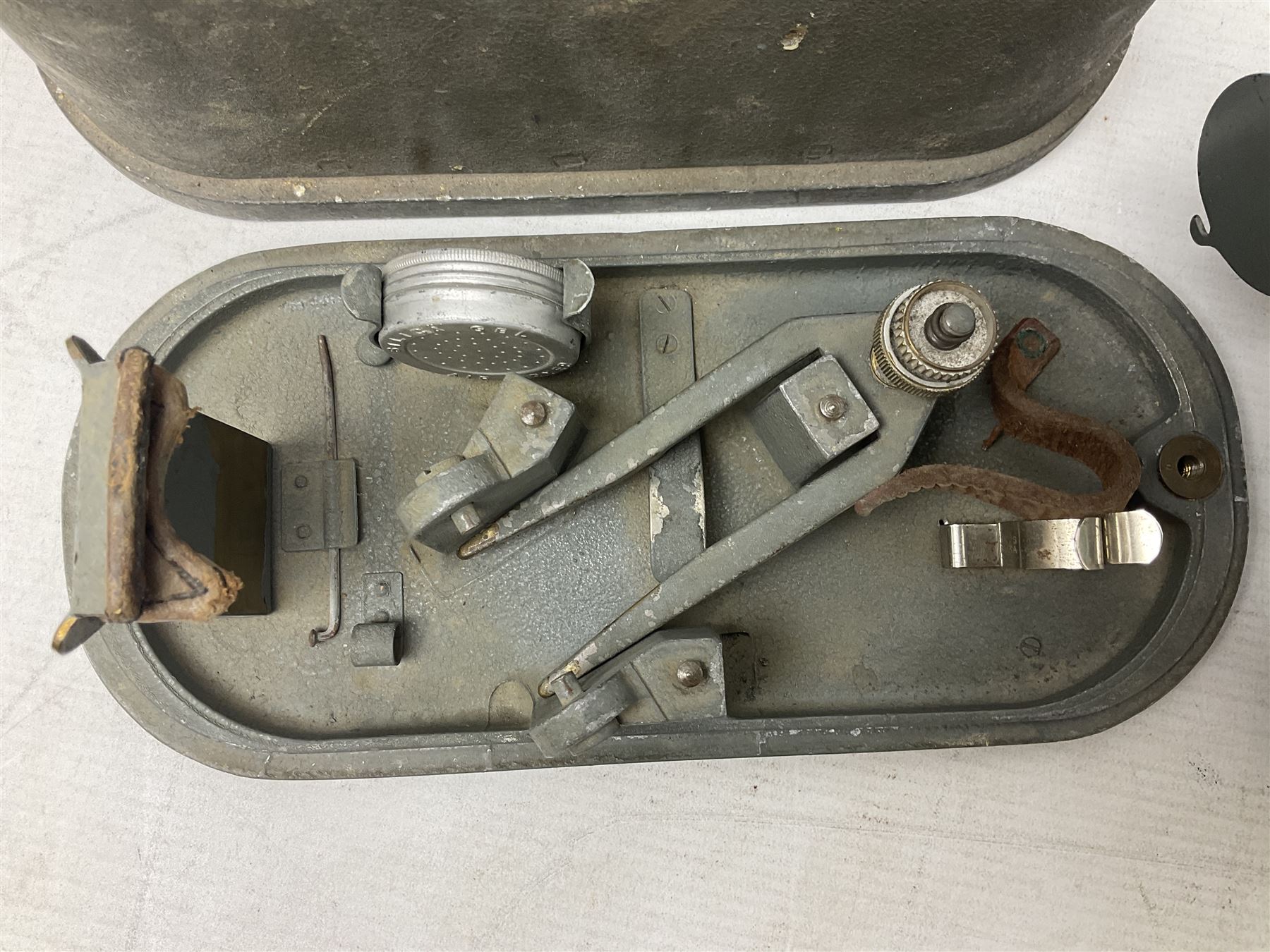 Cooke Troughton & Simms grey painted brass dumpy level in carrying case; and WW2 British .303 Vickers Machine Gun brass Clinometer, stamped 'V.E. 0067' serial No. 2370,  dated 1944 unboxed (2)