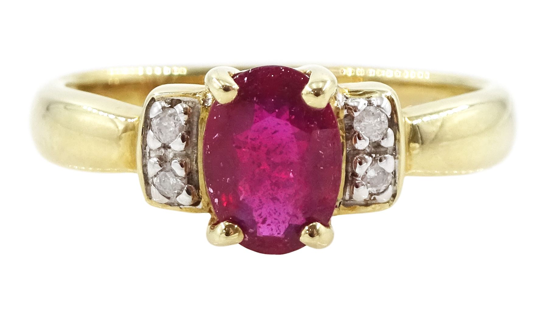 9ct gold single oval cut ruby and four stone, round brilliant cut diamond ring, hallmarked, ruby approx 0.75 carat