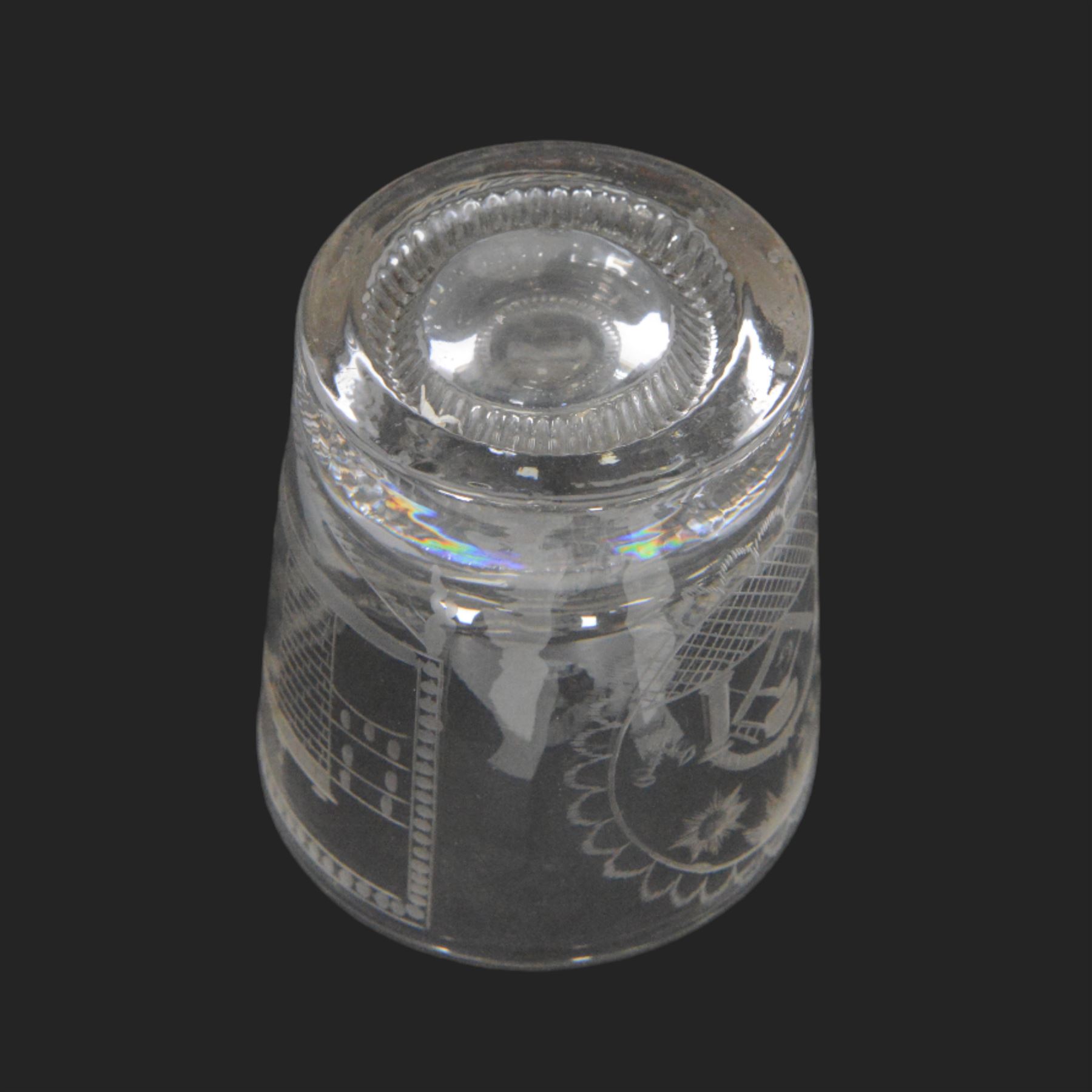 Unusual 19th century Sunderland Bridge and Masonic glass tumbler, circa 1800-1830, of slightly tapering cylindrical form, engraved with a masted frigate sailing beneath the Sunderland Bridge, and circular panel containing Masonic symbols including sextant, keys, and sun, moon and stars verso, with moulded concentric ring beneath, H9cm