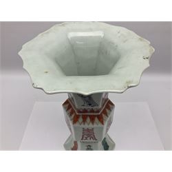 Chinese Kangxi gu vase, of hexagonal form with fluted rim, decorated in polychrome enamels with a male figure to each panel and red character marks to centre, with painted red leaf mark beneath, H32.5cm