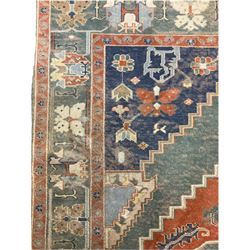 Turkish Yörük green and blue ground rug, central lozenges decorated with stylised plant motifs