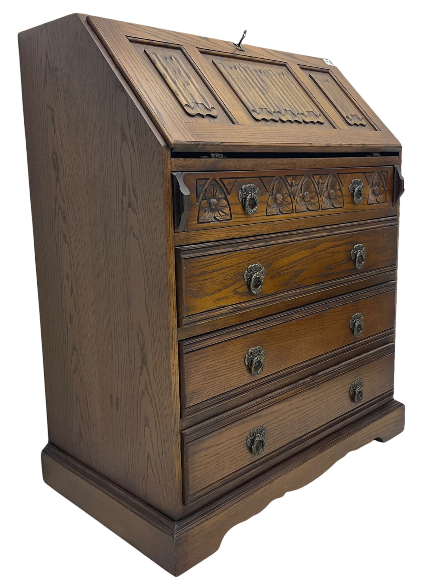 Old Charm oak bureau, fitted with fall front above four drawers