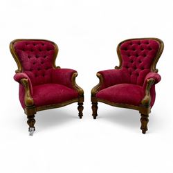 Pair of Victorian walnut spoon back armchairs, with moulded balloon shaped frames and deep...