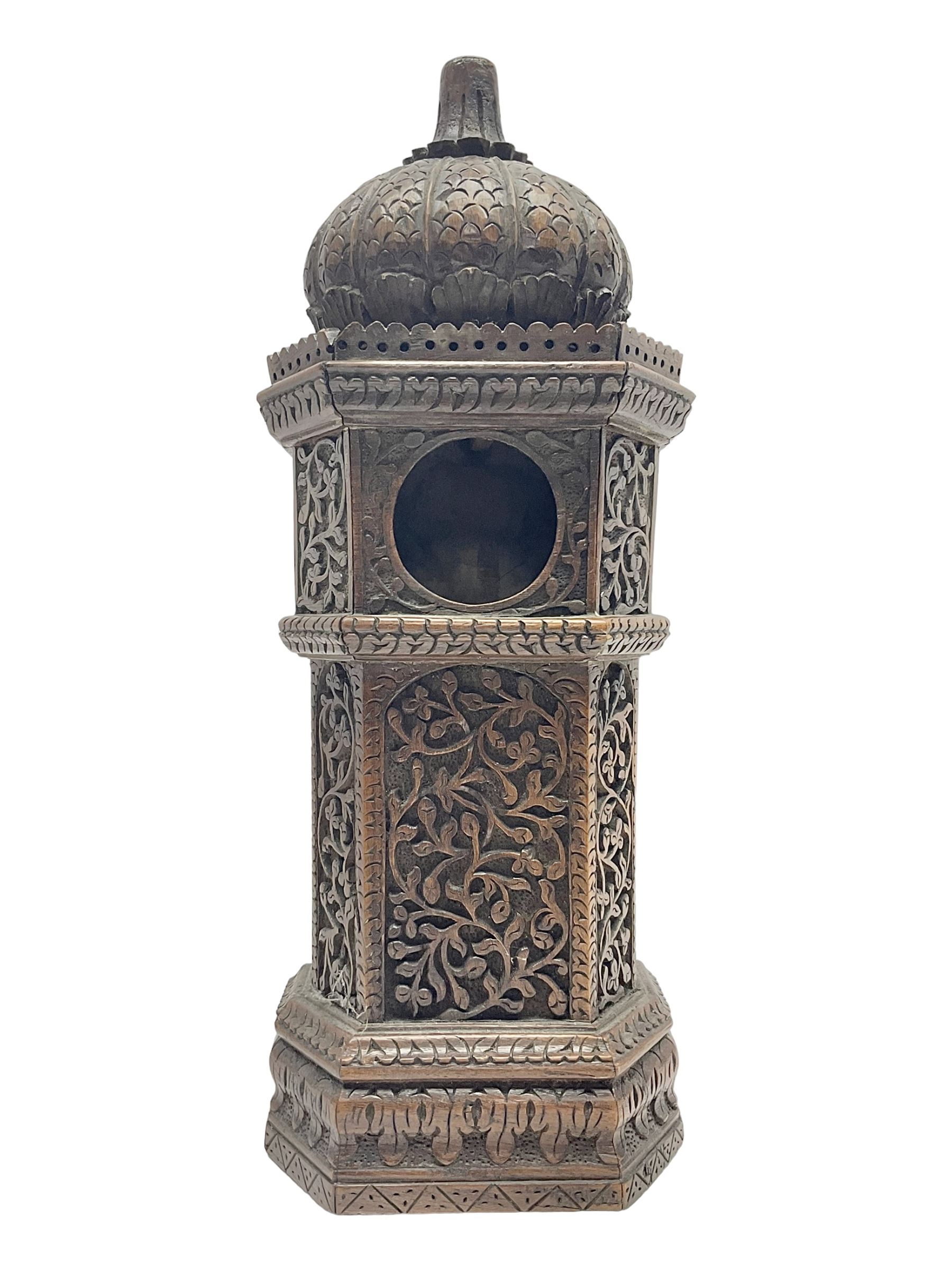 Carved wooden pocket watch holder/stand, in the form of a clock tower, with carved floral design and domed top, H36cm