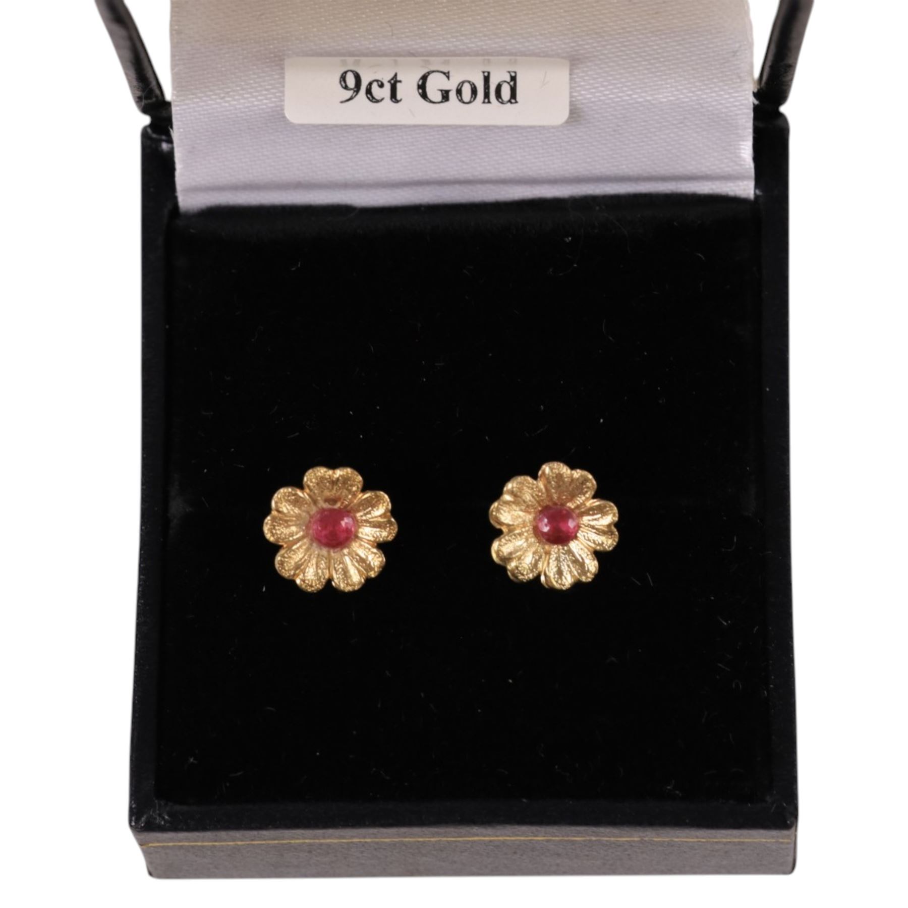 Pair of 9ct gold and ruby flower stud earrings, boxed