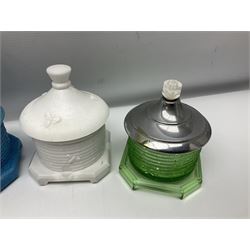 Collection of glass beehive honey pots, to include a blue slag example, milk glass, pink, green, etc together with four white metal examples (16) 