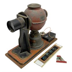 Ernst Plank Germany toy tin-plate fixed lens magic lantern of globular form with original burner and additional battery powered illumination, on wooden base L20cm
