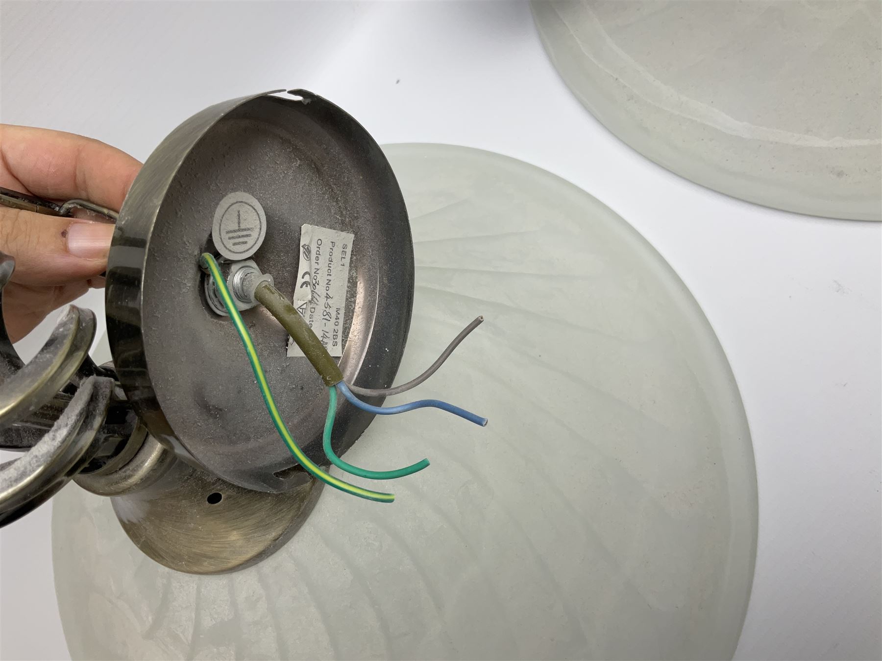 Three frosted glass light fittings with brushed metal mounts, approx L30cm excl fitting