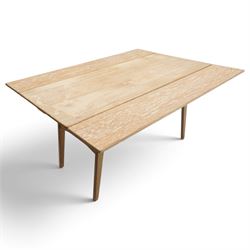 20th century Scandinavian limed oak metamorphic dining-to-coffee table, the rectangular extending top with draw-leaf sides, over an adjustable-height action base, on splayed supports united by stretchers