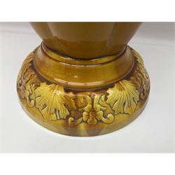 Bretby Jardiniere and stand, with foliate and foliage decoration with a red and yellow ground, impressed mark beneath H94cm