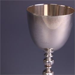 Late 20th century limited edition silver goblet, produced by Garrard & Co Ltd  to commemorate the silver wedding anniversary of Her Majesty Queen Elizabeth II and His Royal Highness the Duke of Edinburgh, the bowl engraved with Royal cyphers and anniversary dates, upon a knopped stem and embossed foot, no. 77/2000, hallmarked Garrard & Co Ltd, London 1972, H15cm