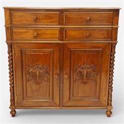Victorian design rosewood side cabinet, the rectangular moulded top above four frieze drawers with turned wooden knob handles, over twin cupboard doors carved with foliate panels, flanked by barley twist uprights, upon turned bun feet