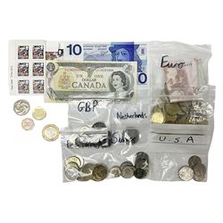 Coins and banknotes, including approximately 45 face value of Euros, various Swiss and Icelandic coins, Canada one dollar banknote etc