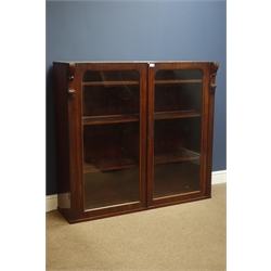  Victorian mahogany bookcase top, two large glazed doors enclosing three shelves, scroll carved corbels, W124cm, H115cm, D37cm  