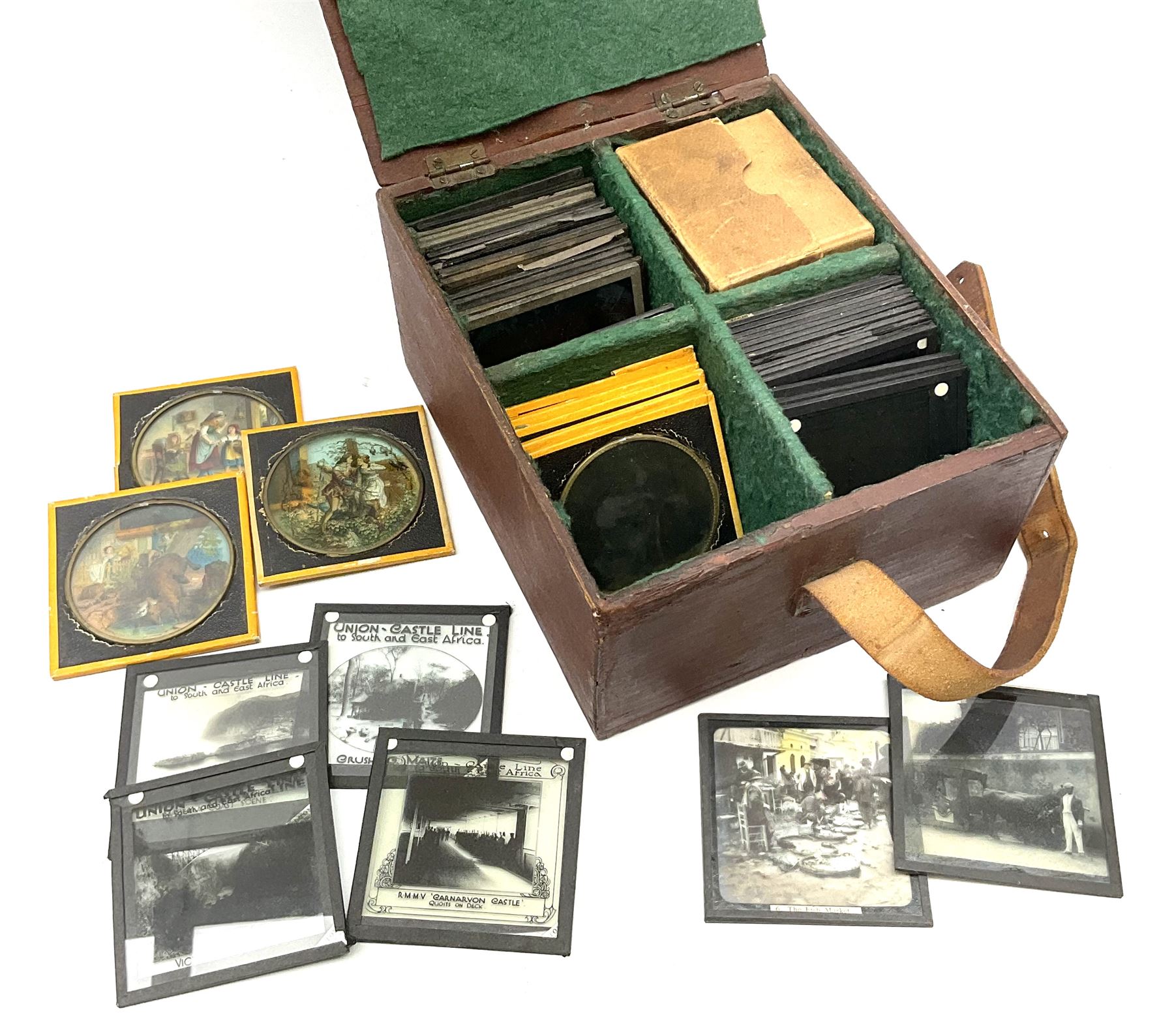 Set of twelve late 19th century magic lantern glass slides entitled 'A Negro's Life', together with forty-two further assorted late 19th/early 20th century magic lantern slides including Union Castle Line to South-East Africa by H.L. Toms London etc, housed in a wooden baize-lined box