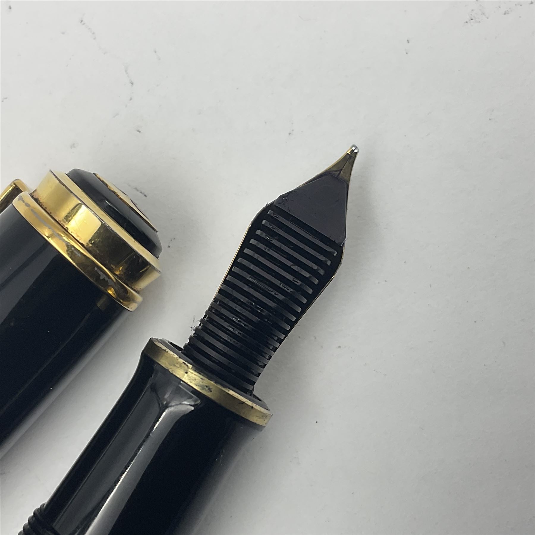 Pelikan M800 Souveran fountain pen, the green and black striped barrel with gilt beak shaped clip and double cap band with gold bi-colour nib stamped 18C-750, L13.5cm