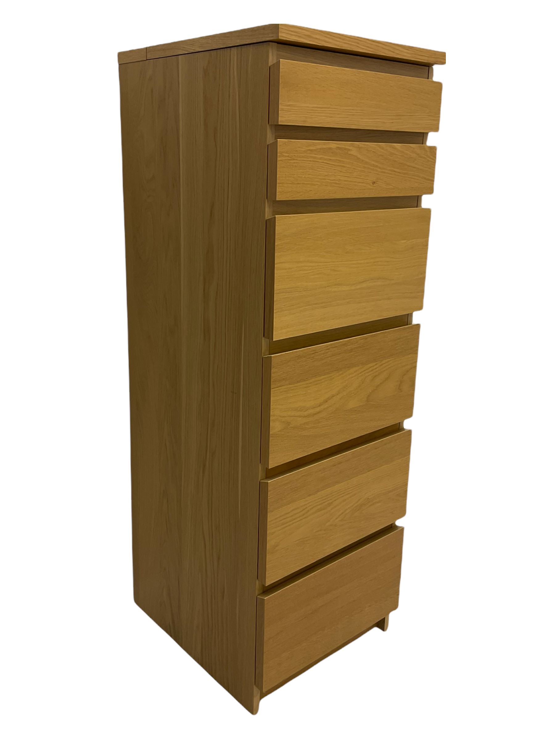IKEA light oak finish chest, fitted with hinged vanity top, above six graduating drawers 