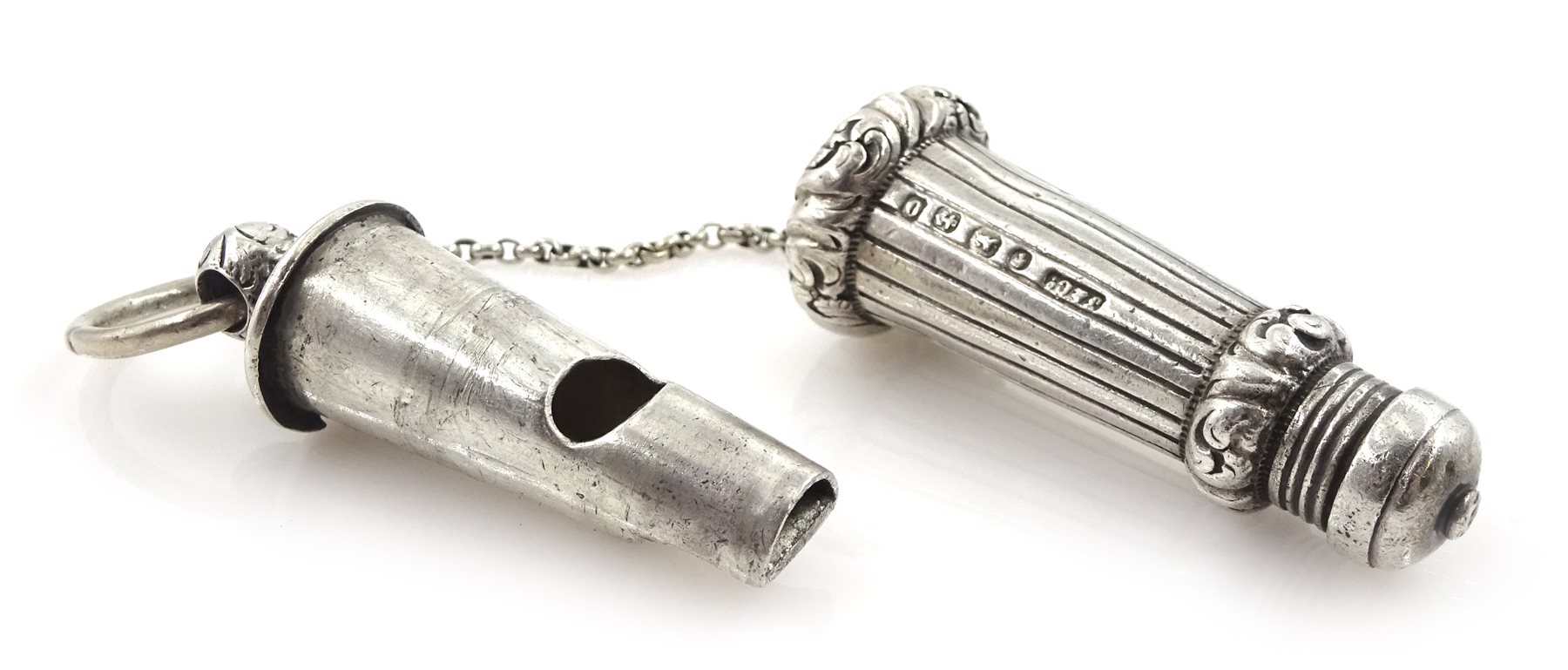 Edwardian silver whistle by William Hornby, London 1902, the metal interior stamped Huloons patent and a Victorian silver whistle, in a silver reeded case by Joseph Jennens & Co, Birmingham 1863