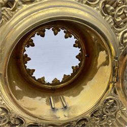 20th century gilt metal monstrance, in the Gothic revival style, with glazed aperture to centre surrounded with clear paste stones, in a pierced floral and scroll border set with coloured paste stones, within a sunburst surround, on a paste set knopped stem and similar foliate foot, H59.3cm