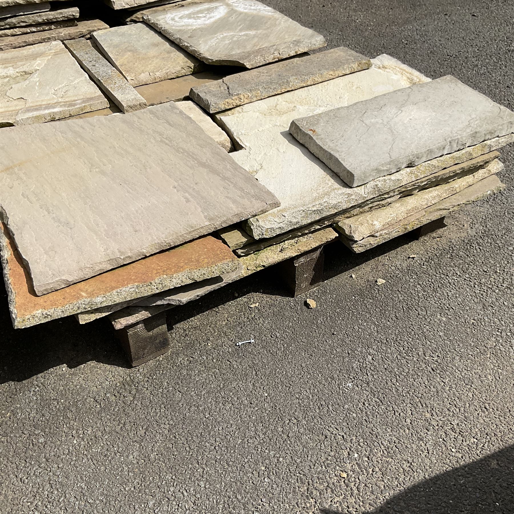 Various paving slabs, coping stone and odd bricks, on five pallets