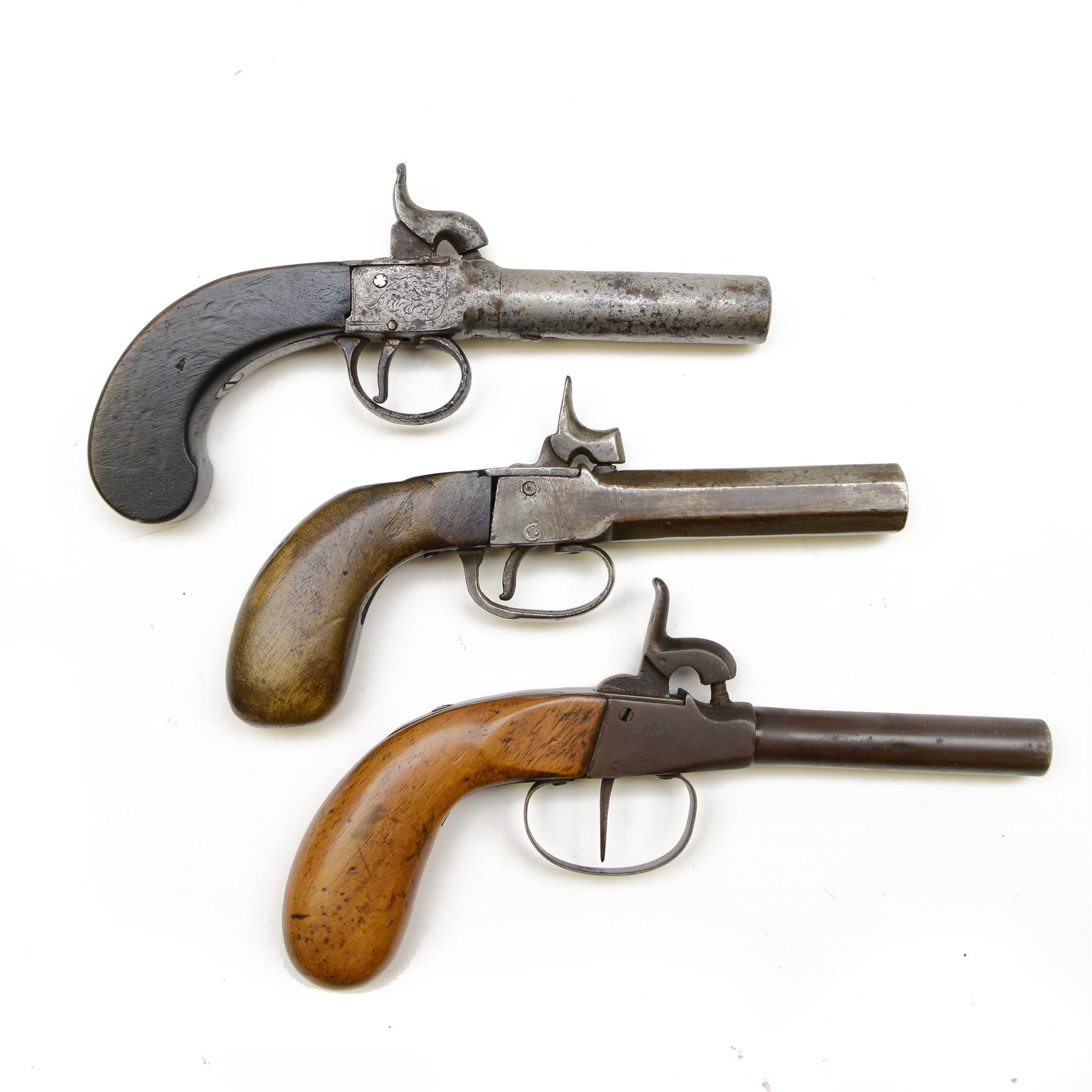 Percussion pistol, with octagonal barrel, bag-shaped wooden butt, together with two other percussion pistols   