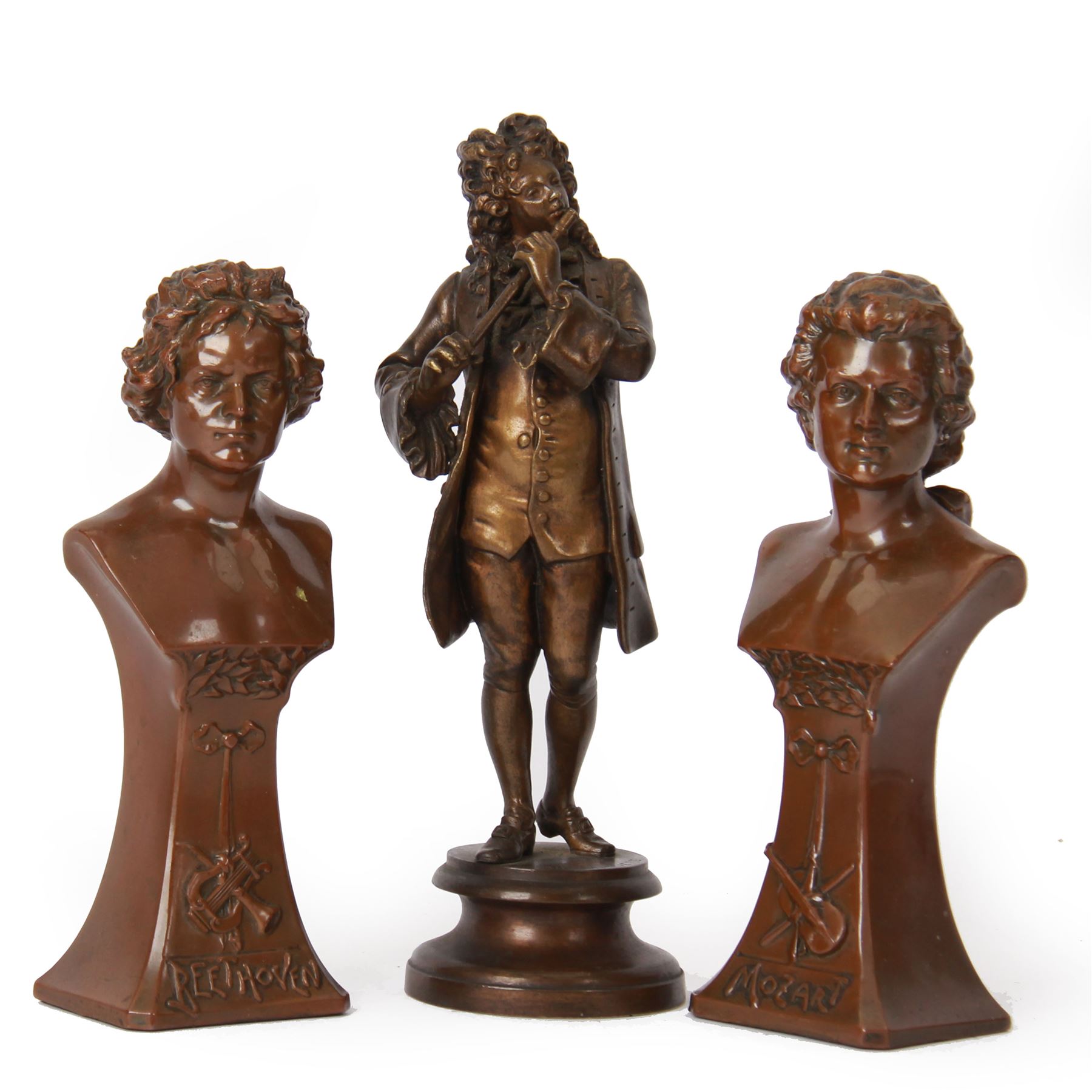Cast metal figure depicting man in classical dress playing a flute, signed to base Par Lalouette, together with a pair of busts, depicting Beethoven and Mozart, tallest H22cm