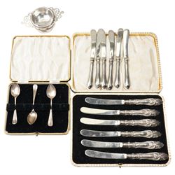 Silver tea strainer and stand Sheffield 1934, two sets of six silver handled pastry knives...