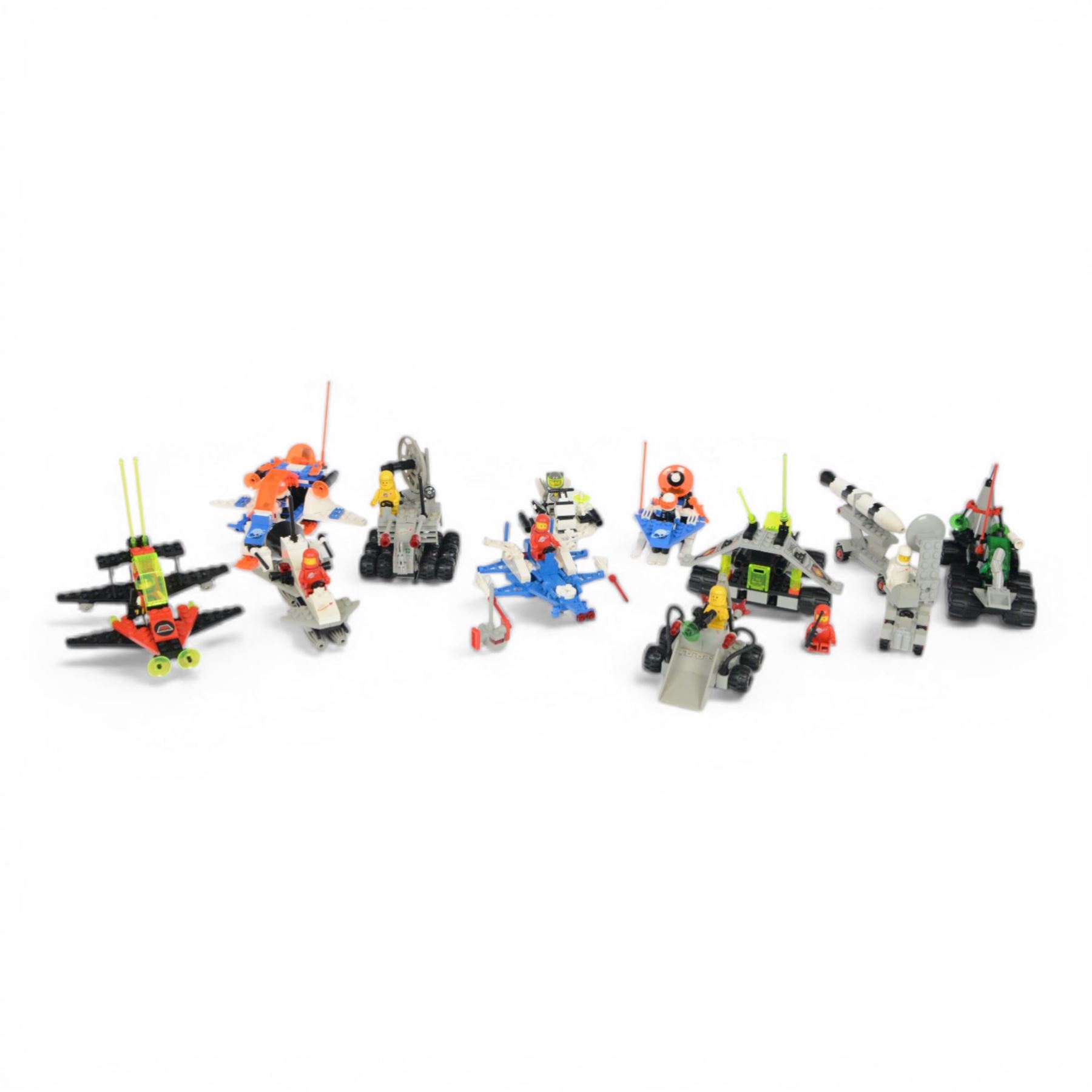 Eleven vintage Lego spaceships, comprising no. 6842 Shuttle Craft, no. 6879 Blizzard Baron, no. 6877 Vector Detector, no. 6880 Surface Explorer, no. 6852 Sonar Security, no. 897-1 Mobile Rocket Launcher, no. 6847 Space Dozer, no. 6834 Celestial Sled, no. 6846 Tri-Star Voyager, no. 6829 Radon Rover and no. 6815 Hovertron, all built with minifigures