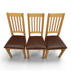 Modern solid oak dining table with set six chairs, chairs with brown leatherette seat