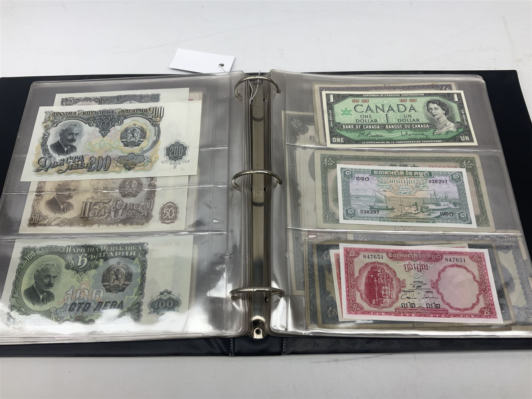 World banknotes, including Queen Elizabeth II The States of Jersey one pound 'DB202703', five pounds 'BB527762' and ten pounds 'AB651481', reserve bank of New Zealand two dollars '1L3 741894', King George V Straits Settlements one dollar 1st January 1935 'F/83 28924', various Bank of England notes etc, housed in two ring binder albums