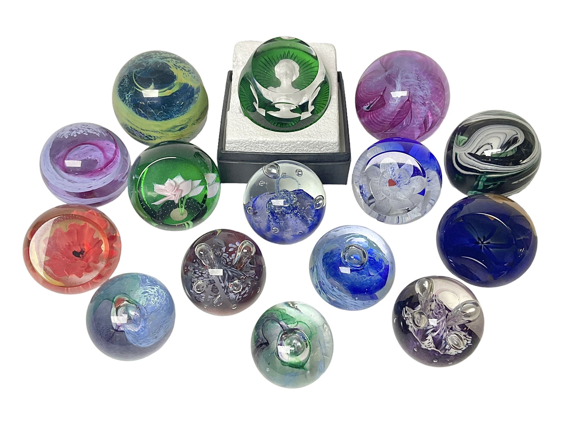 Twelve Caithness glass paperweights, to include Pastel, Mooncrystal and Fiesta, together with Baccarat 'The Princess Anne' paperweight and two Mdina examples (15)