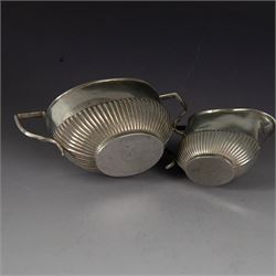 Early 20th century silver milk jug and open sucrier, each of oval part fluted form, hallmarked Birmingham 1911, maker's mark worn and indistinct, H7cm