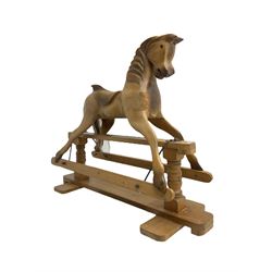 Terry White for White Horses (Hertfordshire 20th century) - Carved pine rocking horse, raised on a pine trestle base