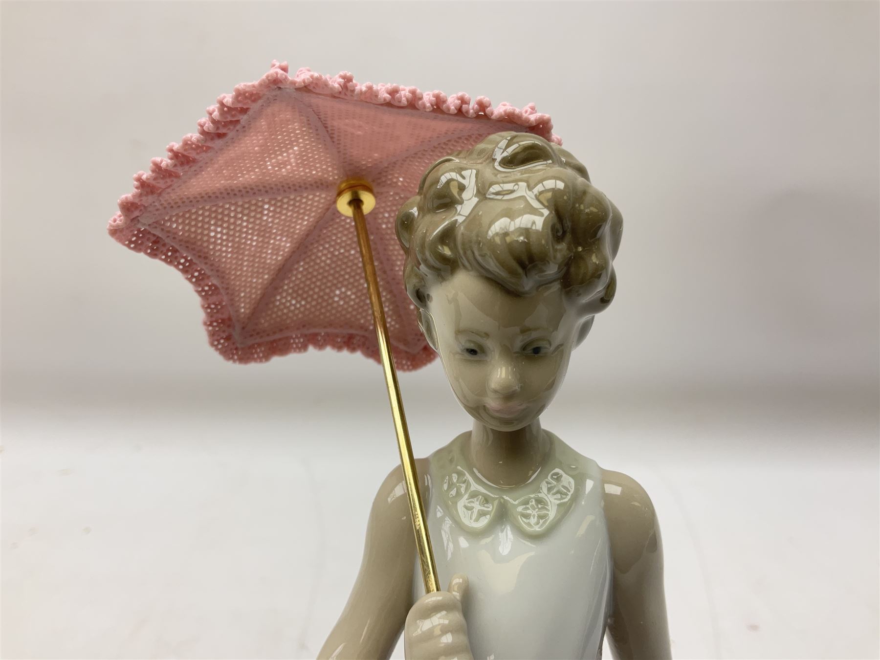 Two Lladro figures, comprising Garden Classic, no 7617 and Garden Song, no 7618, with original boxes and artists signature beneath, largest example H23cm