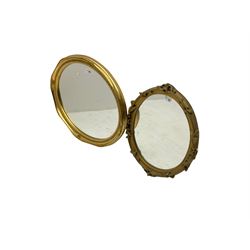 Gilt framed wall mirror, oval bevelled plate with cartouche and scroll detail, with another similar (2)