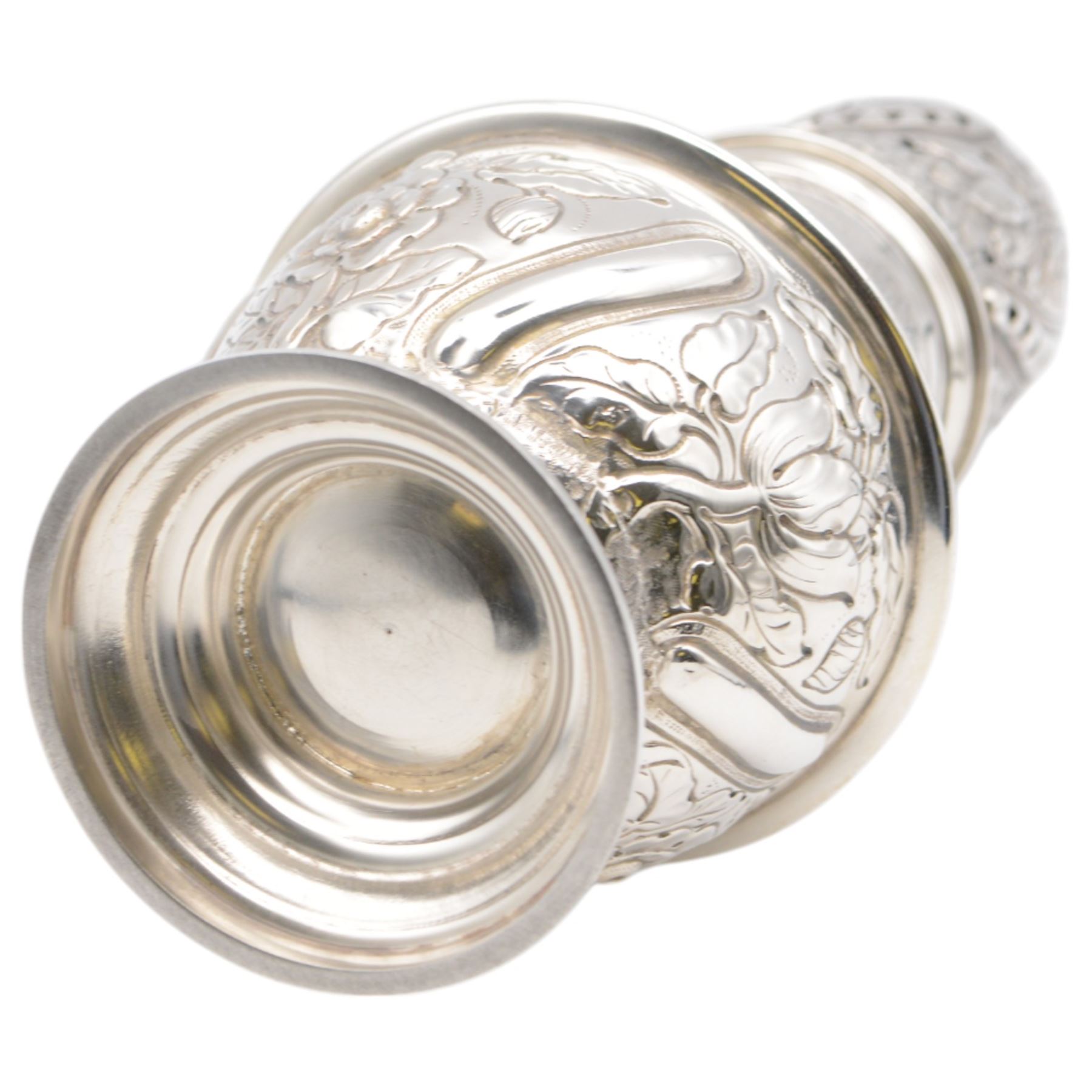 Victorian silver sugar caster, of typical waisted form with engraved and embossed floral and berry decoration, the removable pierced cover with urn finial, upon a circular stepped foot, hallmarked Charles Edwards, London 1884, H20.5cm