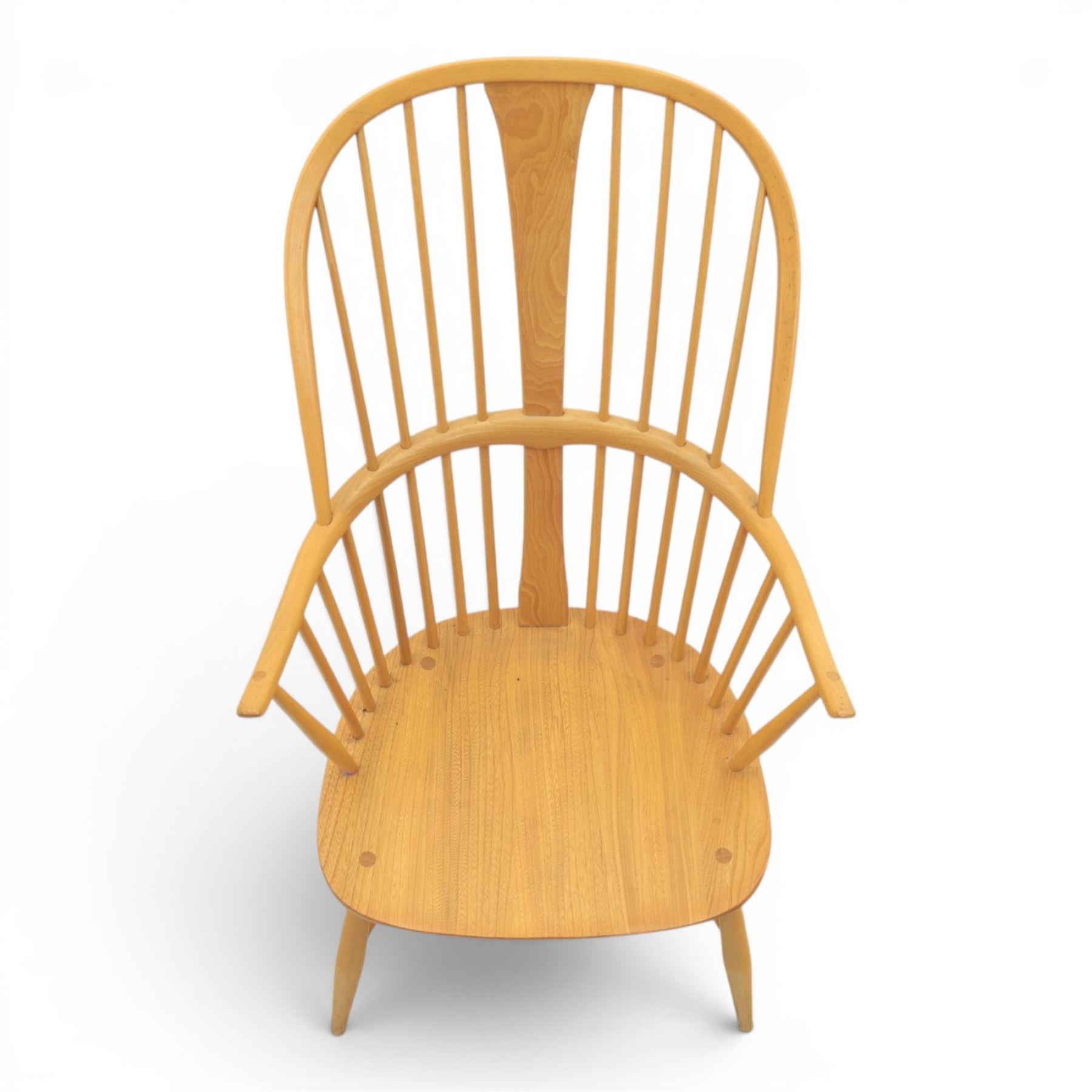 Ercol - Windsor 'Chairmakers' light ash armchair, with traditional spindle backrest, above a dished seat, with cylindrical supports united by a carolean stretcher