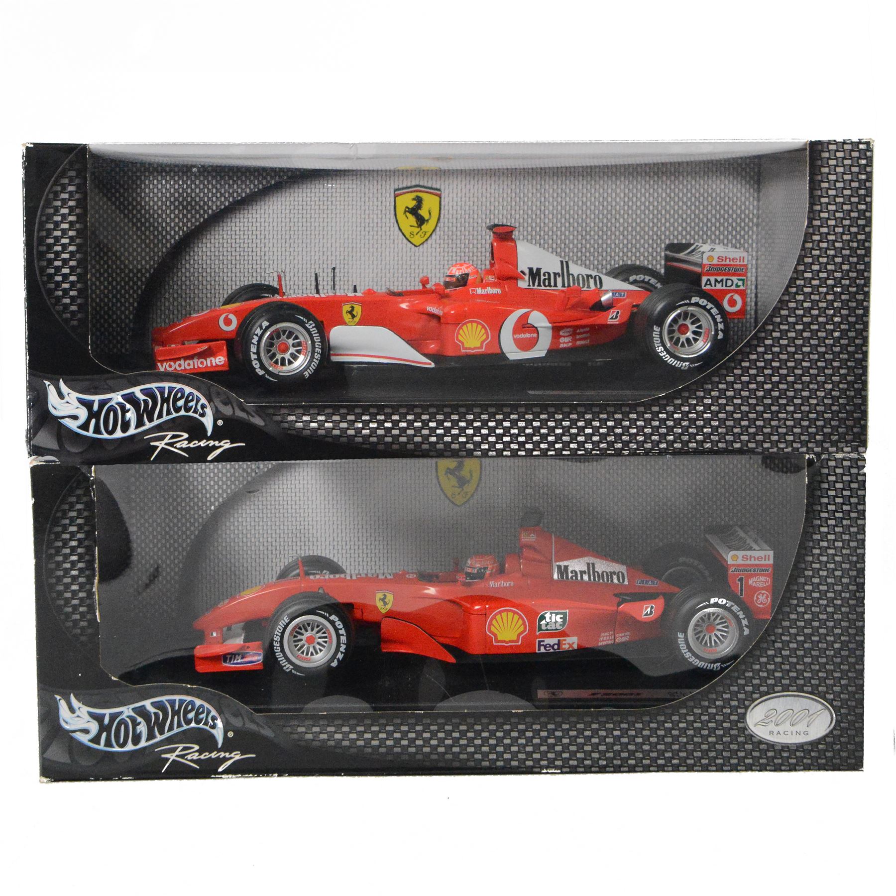 Two Hot Wheels Racing Michael Schumacher Collection 1:18 scale diecast model Formula 1 cars, comprising Ferrari Rednose F2001 and Ferrari F2002, both boxed