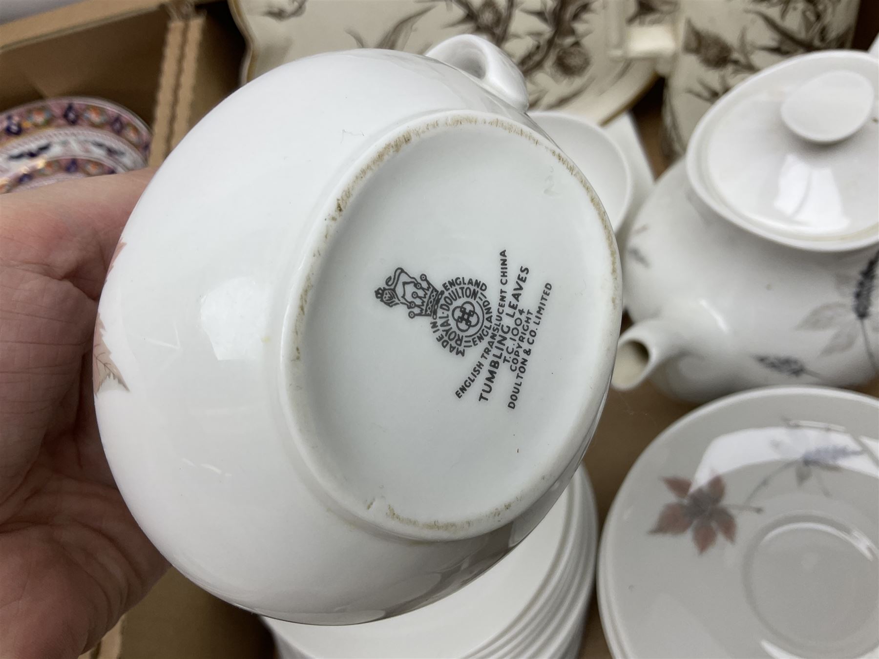 Denby Greenwheat pattern dinner wares, together with Royal Doulton Tumbling Leaves pattern tea and dinner wares, Royal commemorative ceramics including Wedgwood Jasperware table lighter, pair of Victorian glass hand painted vases, large blue and white urn with lid, Noritake part tea set, Staffordshire style dog and other ceramics and collectables, in boxes