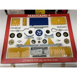 Meccano - Outfits 2, 3 & 4 with blue and yellow parts; look to be virtually complete with most apertures filled; together with a partially stocked Meccano Elekrikit; all boxed with instruction manuals (4)