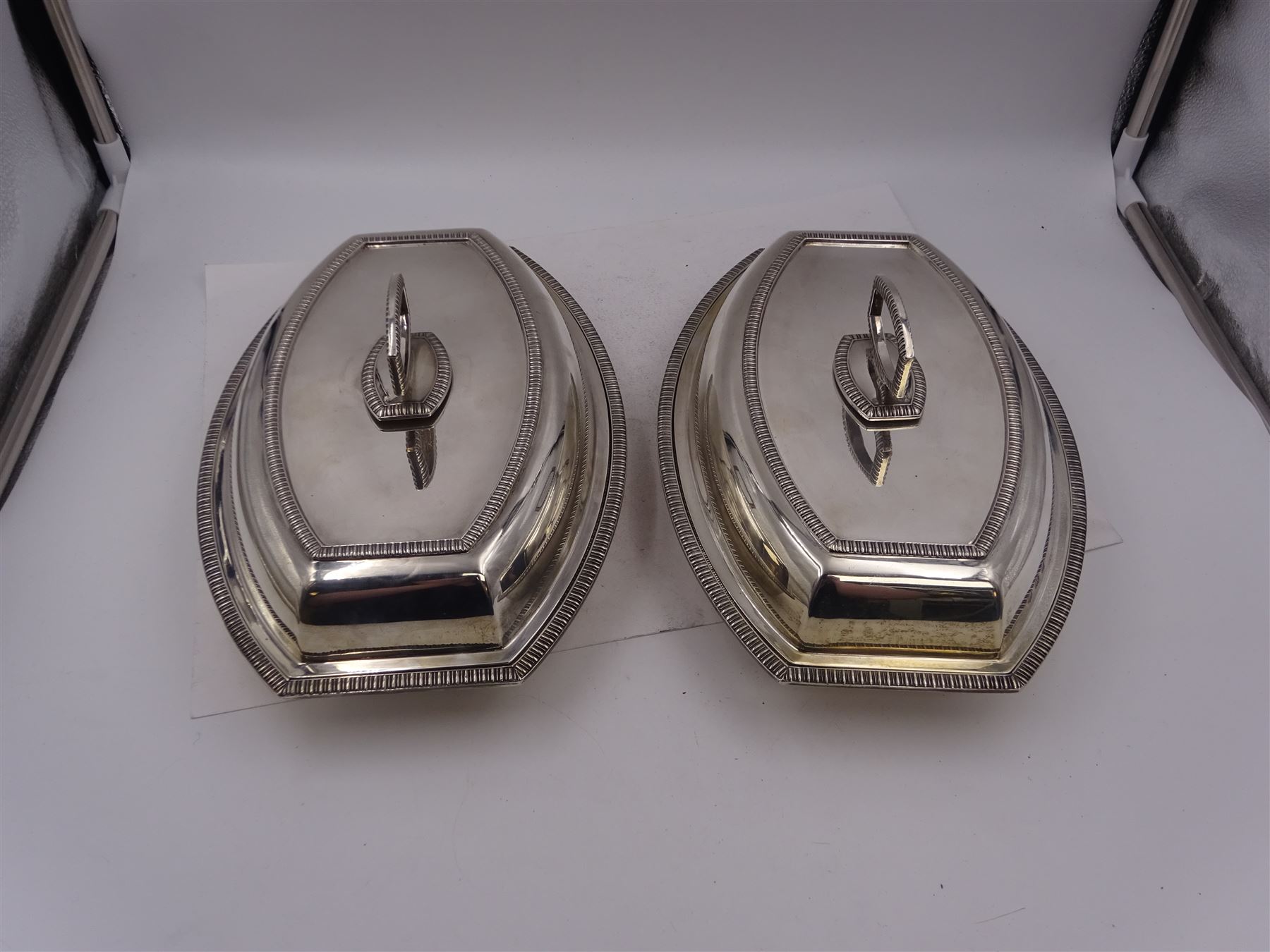 Pair of 1930s silver serving dishes with covers, each with removable handles, hallmarked Barker Brothers Silver Ltd, Birmingham 1935, L27.5cm, H12cm