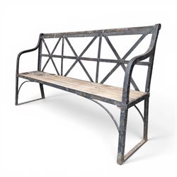 19th century and later Estate made wrought iron strapwork garden bench, the weathered wood...