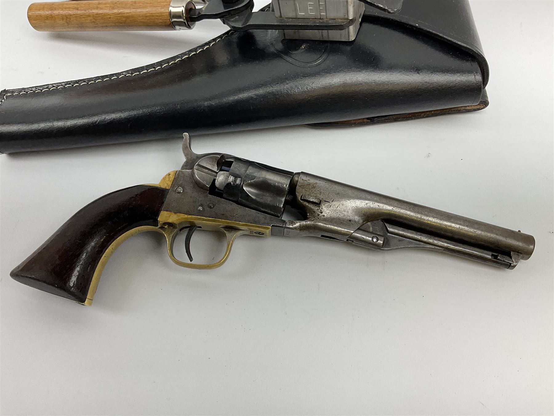 Colt .36 calibre percussion five-shot police pocket revolver, all parts with matching serial no.18334, 14cm barrel marked 'Address Col Saml Colt New York US America' with under barrel swivel rammer, brass trigger guard and backstrap with two-piece wooden grips L28.5cm; with modern bullet maker and leather holster.