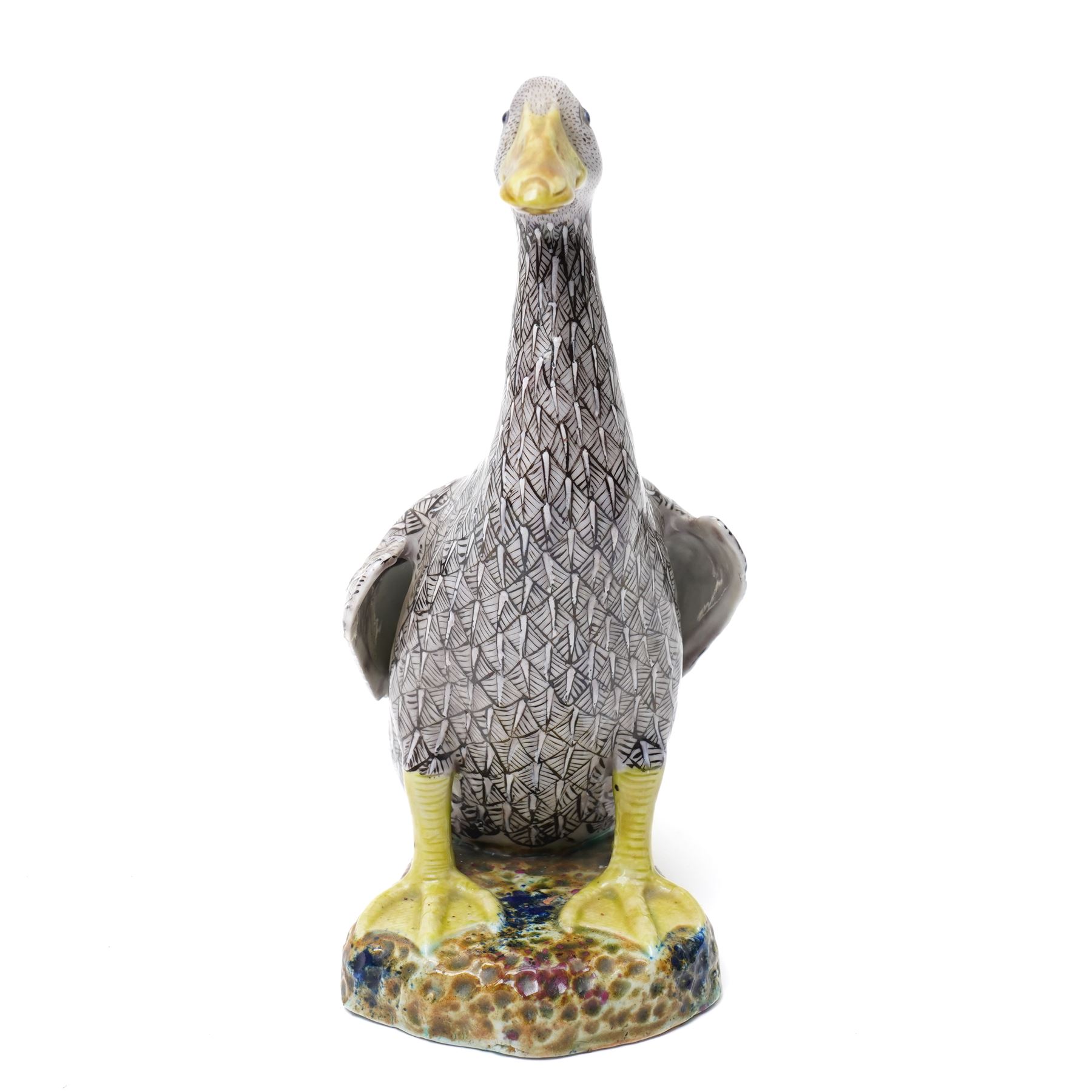 Pair of 20th century Chinese Export porcelain ducks, each naturalistically modelled with aubergine and white enamel plumage and seated on polychrome rockwork bases, H24cm 