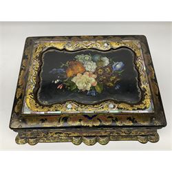 Victorian papier-mâché writing slope, of rectangular form with scalloped base, decorated throughout with gilt scrolls, the cover with central hand painted floral spray within a mother of pearl and abalone inlaid border, opening to reveal a red velvet lined slope and compartments, H10.5cm L32.5cm D24.5cm