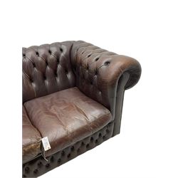Three-seat Chesterfield sofa, upholstered in buttoned brown leather 